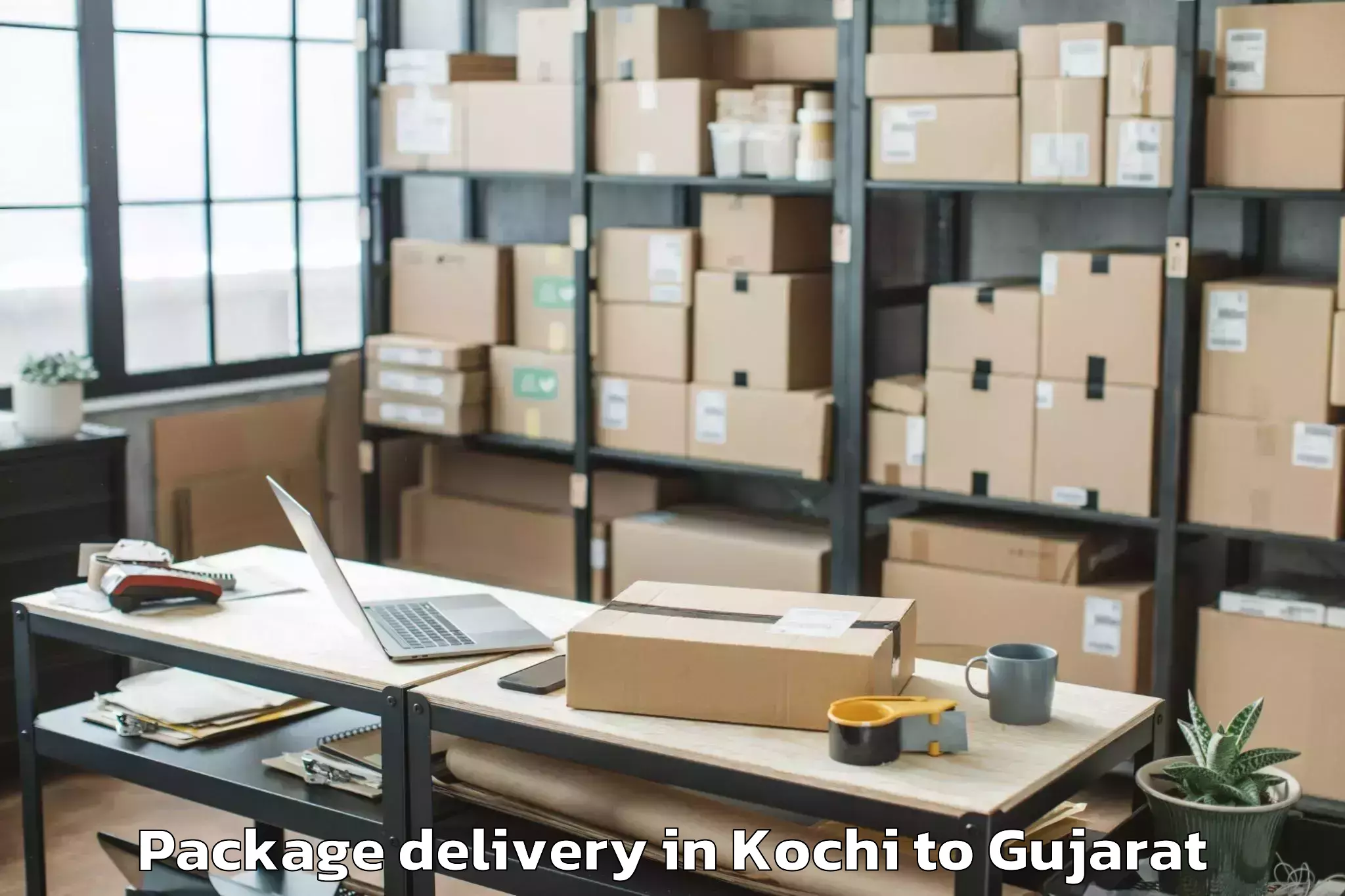 Professional Kochi to Keshod Airport Ixk Package Delivery